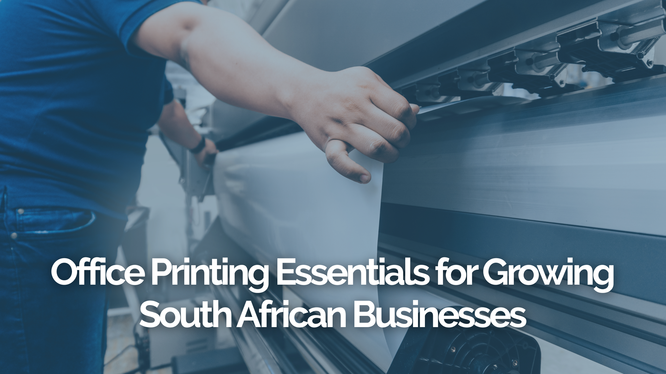 Office Printing Essentials for Growing South African Businesses, guy using a print machine